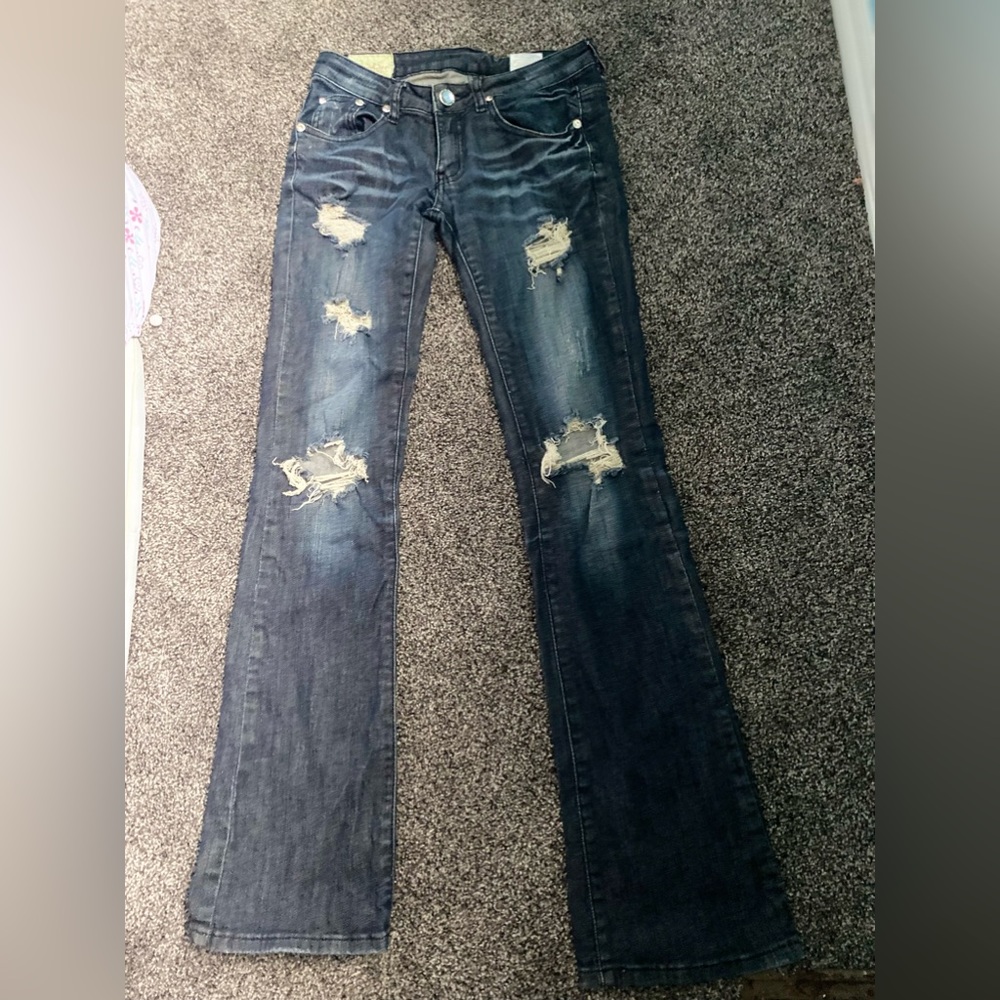 Ripped flare jeans with gems